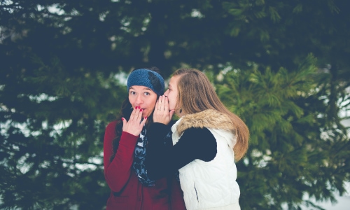 Teenagers gossiping